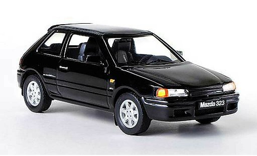 Mazda 323 GTX 1/43 IXO noire LHD 1989 miniature