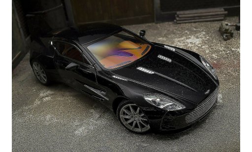 Aston Martin One-77 coupe 1/18 Autoart 77 noire pearl interieur orange miniature