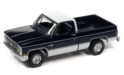 Miniature Chevrolet Silverado 1/64 Auto World 10 Fleetside bleu foncé/blanche 1985 Chevrolet Silverado 1/64 Auto World 10 Fleetside bleu foncé/blanche 1985 miniature