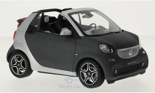 Miniature Smart ForTwo 1/18 Norev fortwo Cabrio (A453) matt-grise/grise Softtop liegt bei Smart ForTwo 1/18 Norev fortwo Cabrio (A453) matt-grise/grise Softtop liegt bei miniature