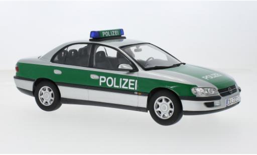Miniature Opel Omega 1/18 Triple 9 Collection B Polizei (D) 1996 1:18 Opel Omega 1/18 Triple 9 Collection B Polizei (D) 1996 1:18 miniature